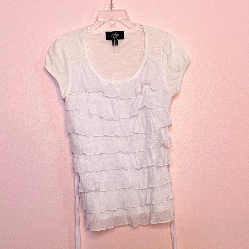 white ruffled top